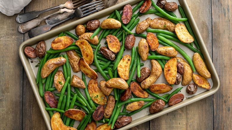roasted vegetables in a jelly roll pan