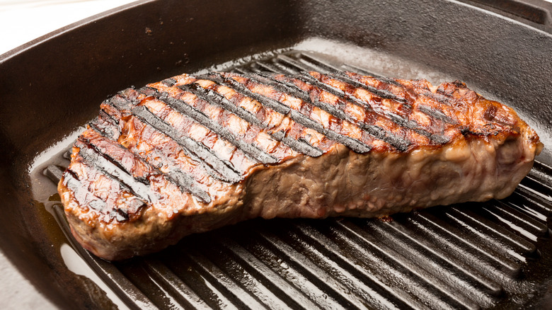 grilled ribeye in a pan