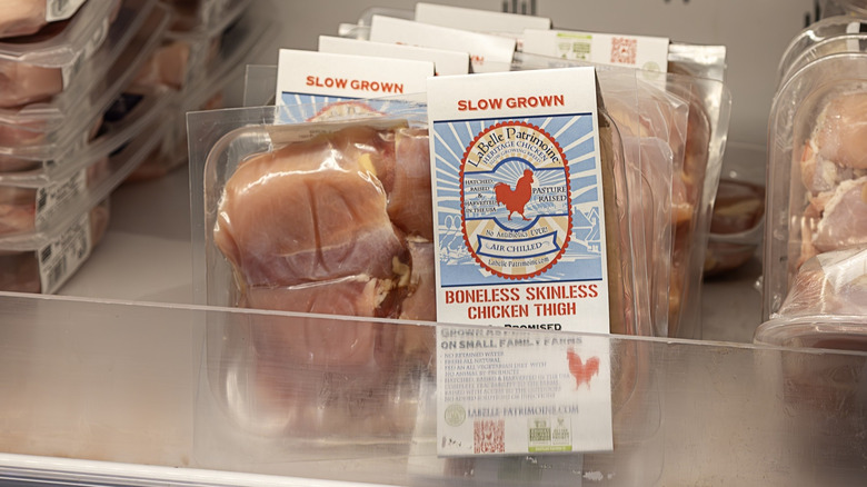 LaBelle Patrimoine air-chilled chicken thighs sit in a cooler at Whole Foods