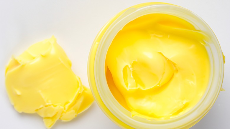 yellow beef tallow in glass jar