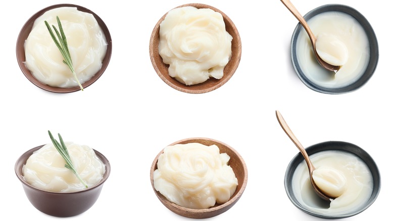 bowls of tallow with herb garnishes and spoons