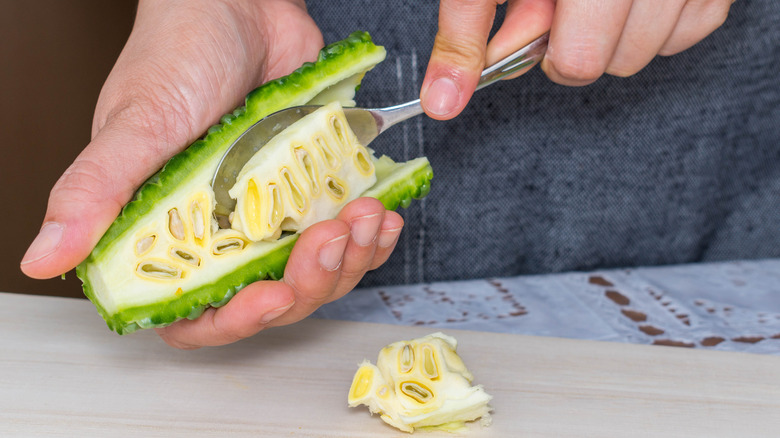 Spoon removing bitter gourd seeds