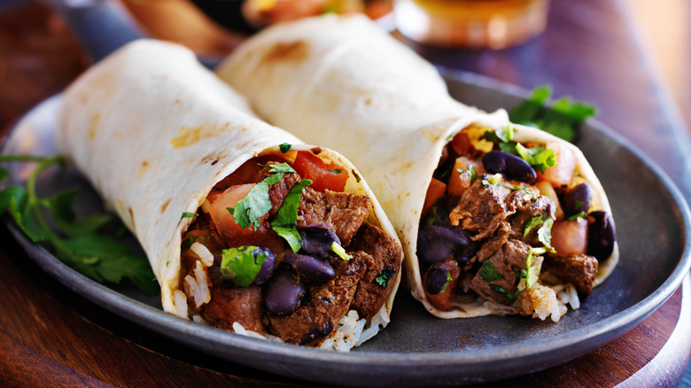 two chopped beef burritos