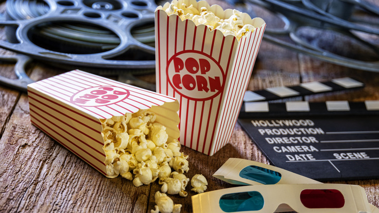 Bags of popcorn with 3-D glasses and film reels