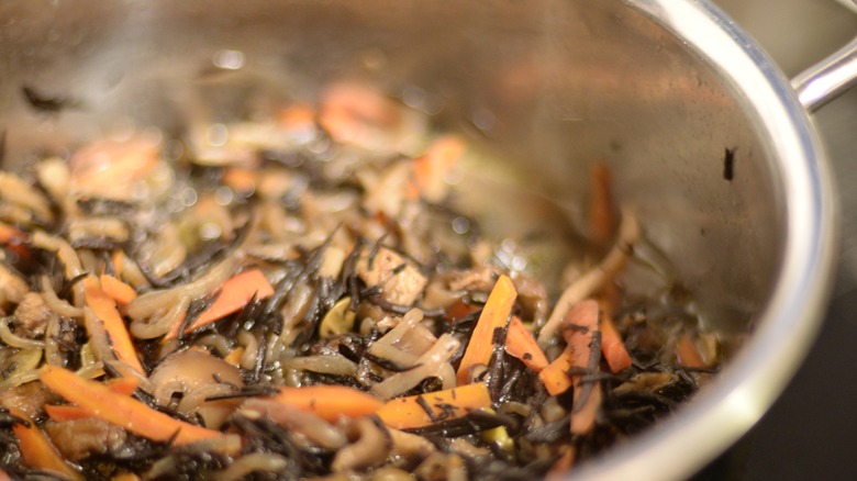 hijiki simmering in a pot along with carrots and mushrooms