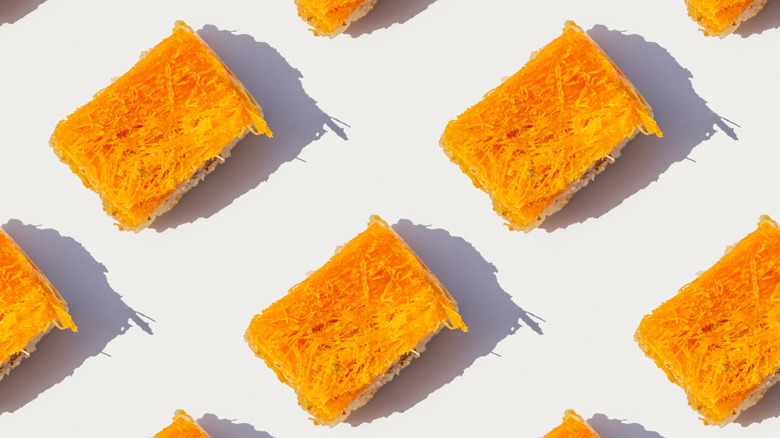 multiple knafeh desserts on white background