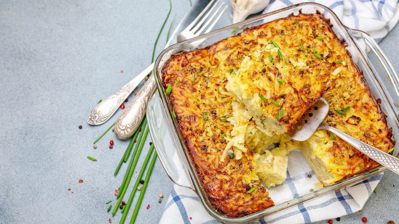 glass casserole dish of savory noodle kugel
