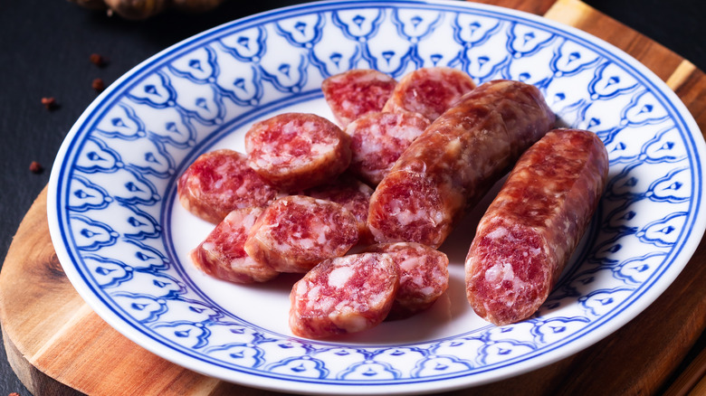 Lap cheong slices on blue and white plate