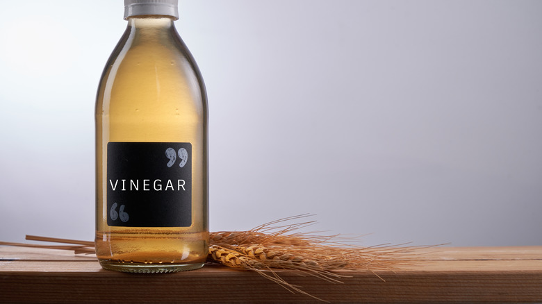 vinegar bottle on counter with barley