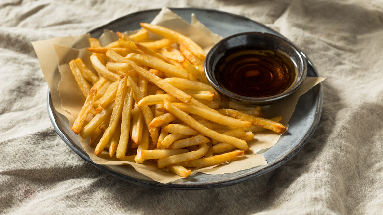 malt vinegar with plate of chips