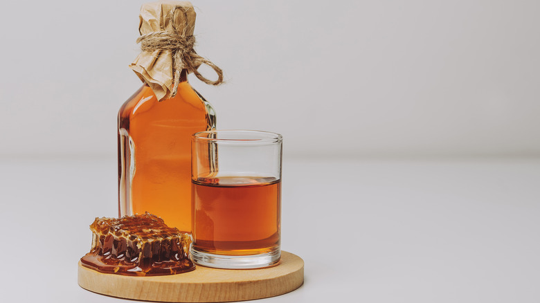 glass and bottle of mead