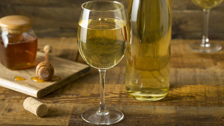 glass and bottle of mead