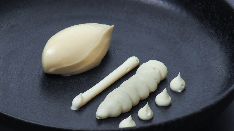 White chocolate namelaka on black plate