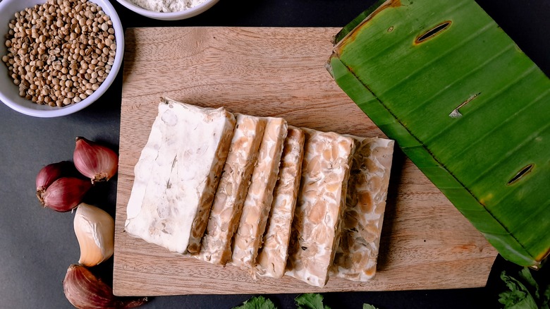 Sliced tempeh on cutting board