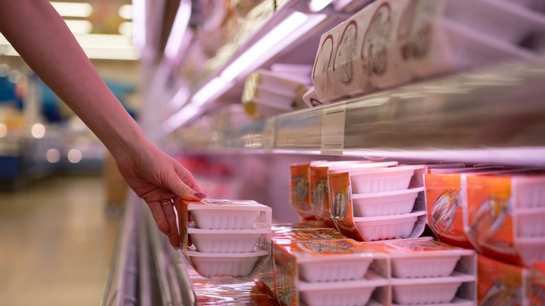 Person buying natto in supermarket