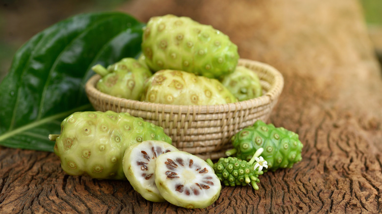 A basket of noni fruits