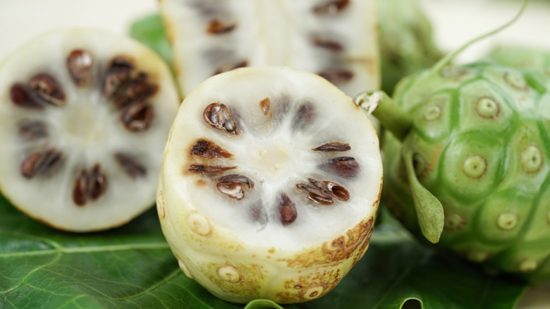 halved noni fruit pods