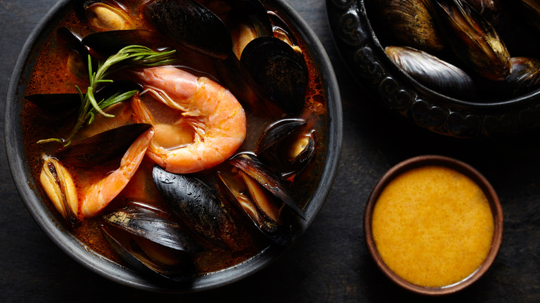 Rouille sauce in a ramekin near bouillabaisse