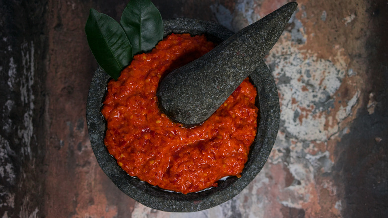 Sambal oelek in a mortar and pestle