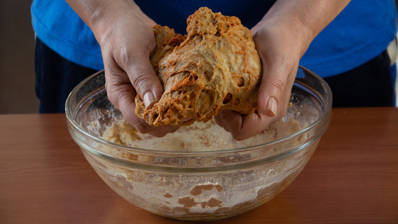 Person kneading seitan