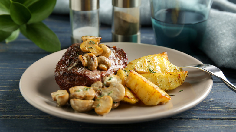 Steak diane with mushrooms and potatoes