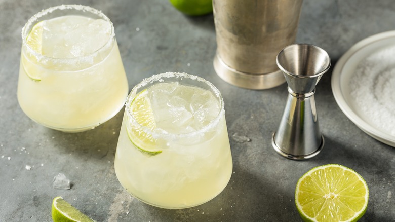Two mezcal margaritas with lime