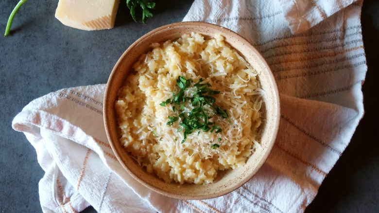 Stelline pasta garnished with parsley and parmesan