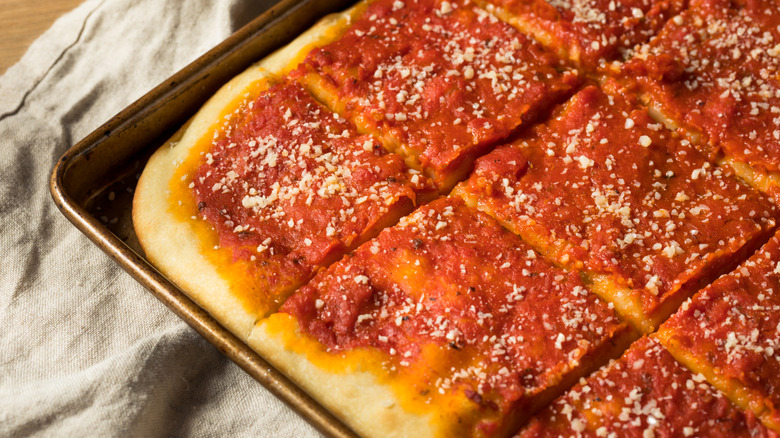 a homemade Philadelphia tomato pie with a sprinkle of parmesan