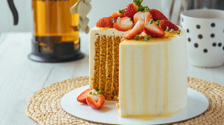 Vertical layer cake with strawberries on top