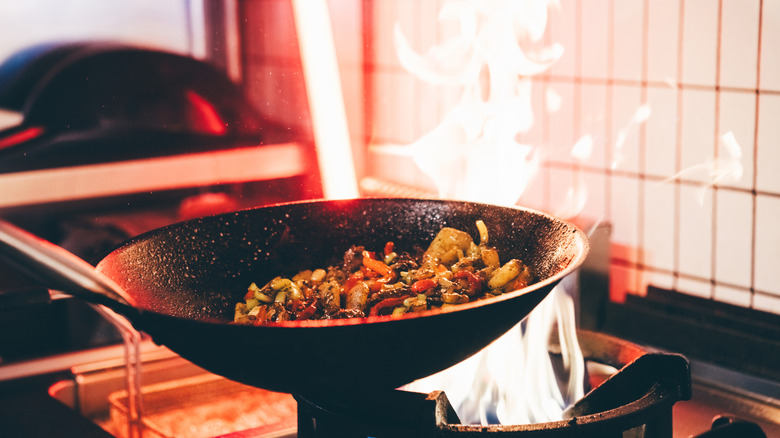 cooking wok stir fry in a kitchen