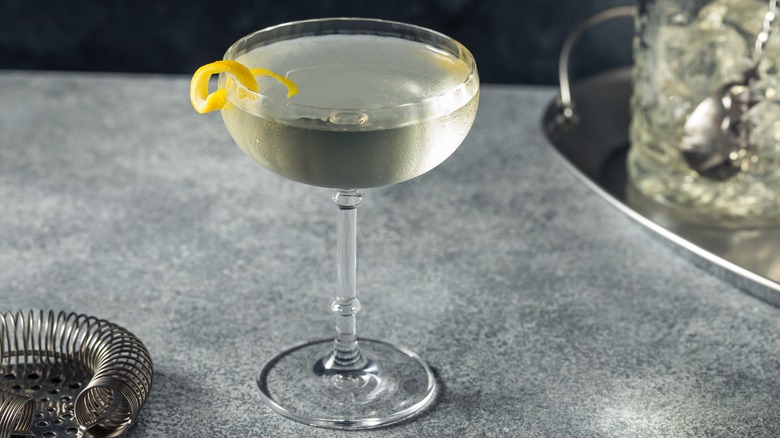 martini with lemon peel in coupe glass