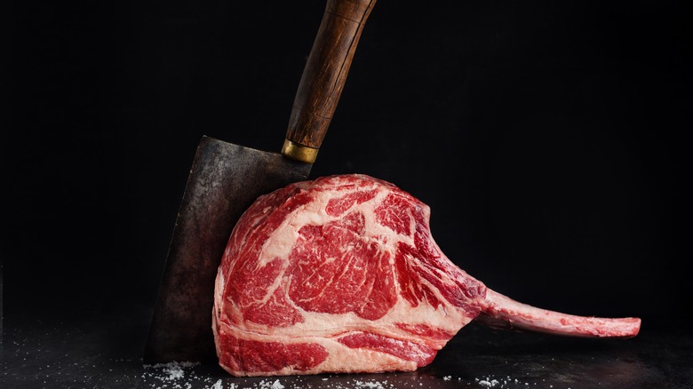large knife in tomahawk steak