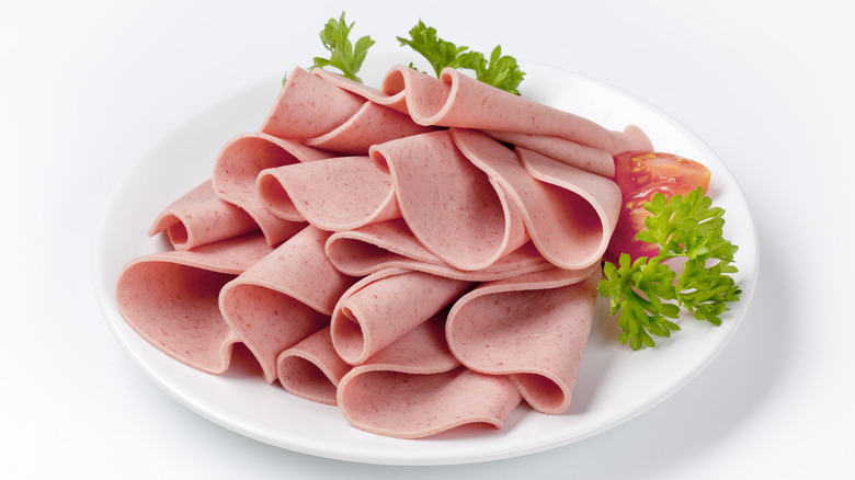 A pile of bologna meat on a plate