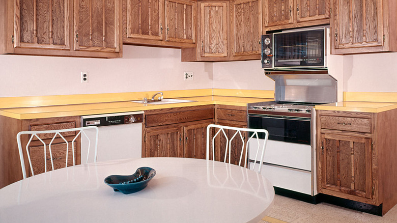 A retro kitchen with yellow laminate countertops