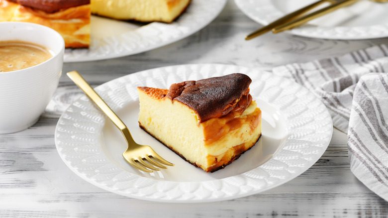 a slice of basque cheesecake on a plate