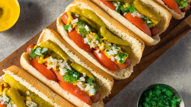 Overhead view of Chicago hot dogs on a board