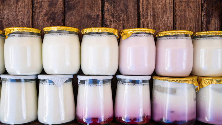Jars of French yogurt stacked on top of one another