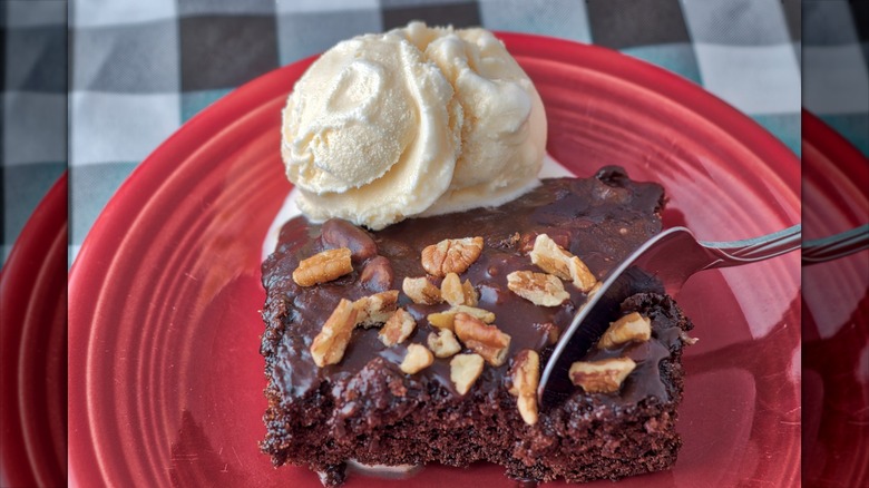 Texas sheet cake with a scoop of ice cream