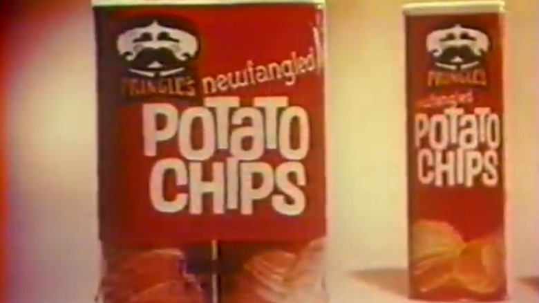 Three packages of vintage Pringles from the 1960s sit side by side.