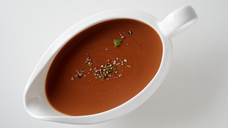 brown gravy in a white gravy boat