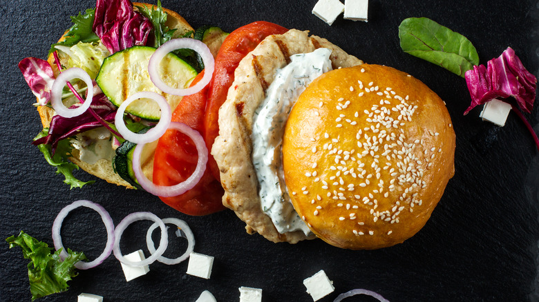 Turkey burger in butter n with onions, tomatoes, and lettuce