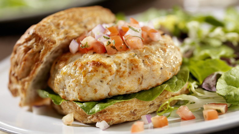 Plated turkey burger with salad