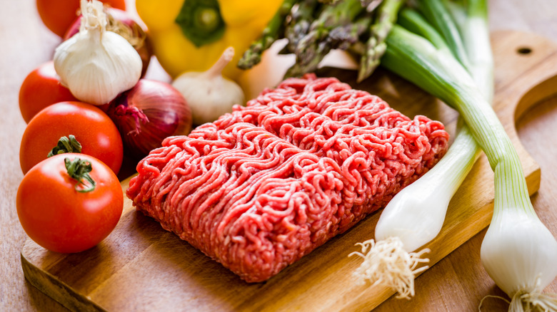 Ground beef on a cutting board.