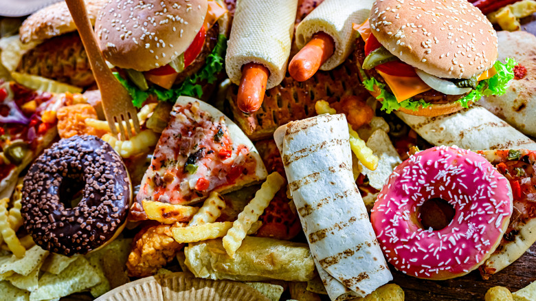 Pile of wasted fast food in garbage