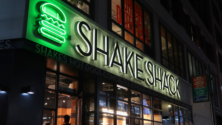 Shake Shack at night with illuminated logo
