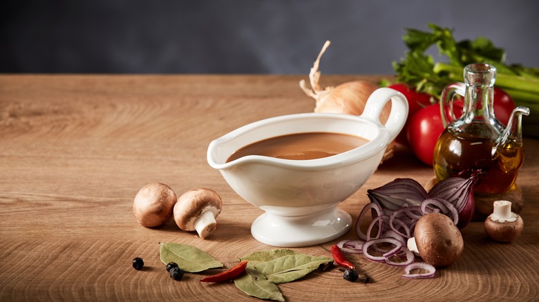 Gravy boat with mushrooms and aromatics