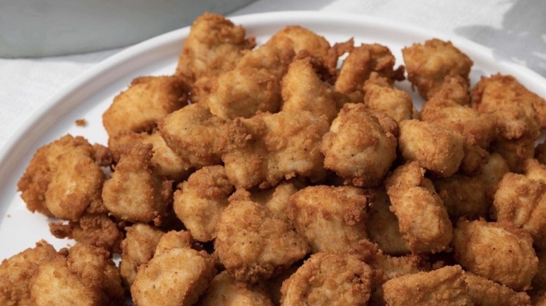 White dish piled with Chick-fil-A chicken nuggets