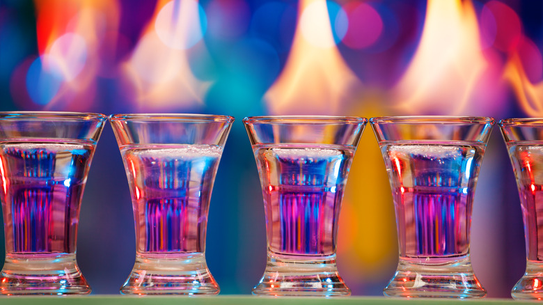 Shots of vodka in front of fiery looking background