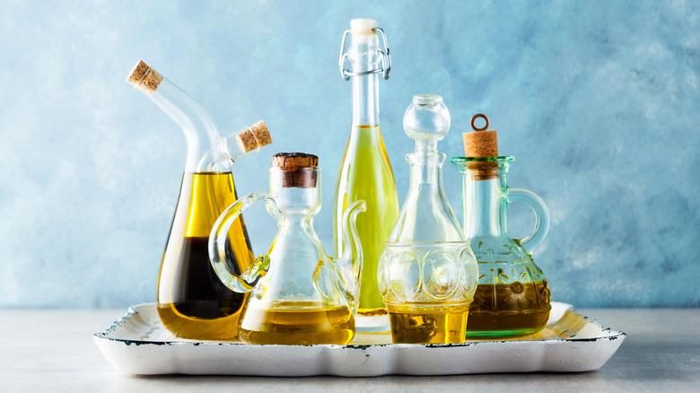 Glass cruet bottles of olive oil