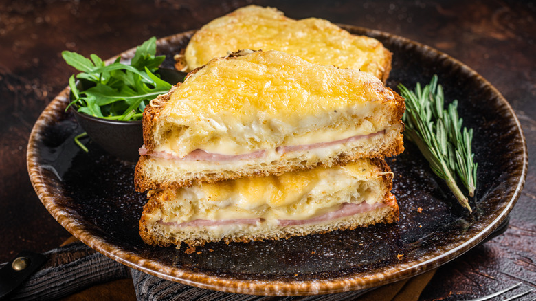 Croque monsieur grilled cheese with Gruyère and ham on plate